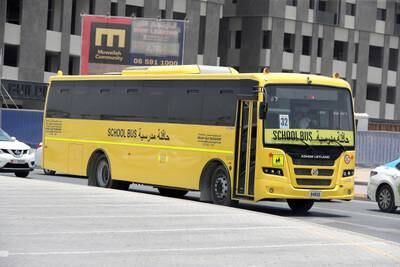 A Sharjah school bus. Parents have turned to WhatsApp to arrange lifts for their children because they cannot afford transport fees. Pawan Singh / The National