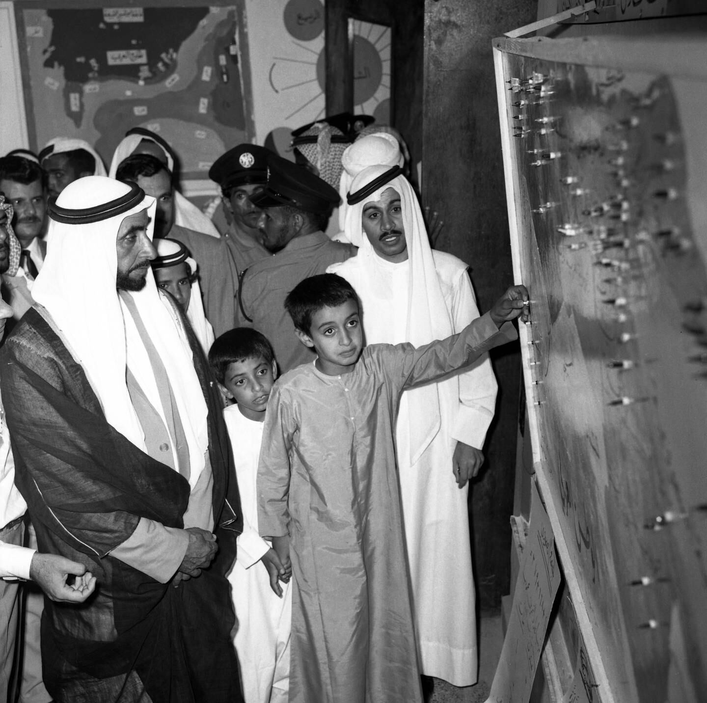 The late Sheikh Zayed with Sheikh Mohamed at the open day at Al Kindi Primary School in Abu Dhabi. Sheikh Mohamed's teacher, Mohamed Al Tamimi is standing behind him. Photo: National Archives