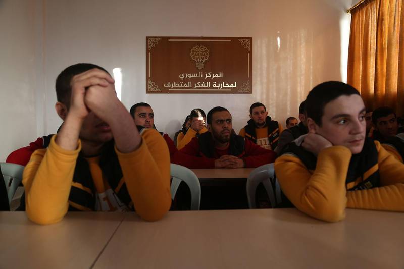 Syrian men attend a lecture at the Syrian Centre for Countering Extremist Ideology in the Syrian town of Marea, in the northern Aleppo district, on November 30, 2017.
In the rehabilitation centre in northern Syria, young men huddle over an innocuous game of chess and some cigarettes -- activities they once brutally suppressed as Islamic State group jihadists.  / AFP PHOTO / Nazeer al-Khatib