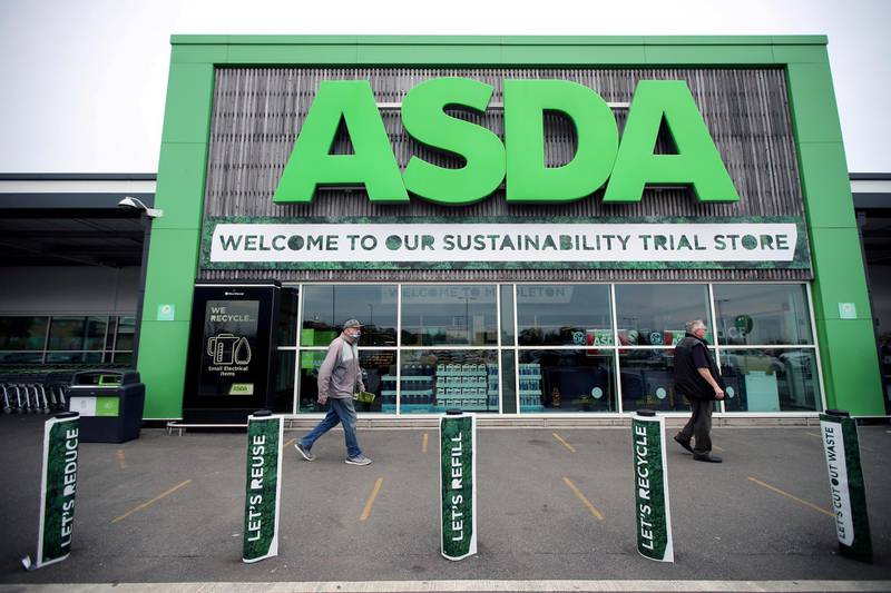 FILE PHOTO: Shoppers walk past the UK supermarket Asda, in Leeds, Britain, October 19, 2020. REUTERS/Molly Darlington/File Photo