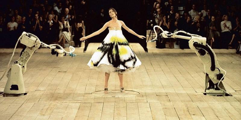 Model Shalom Harlow was sprayed with paint for the spring / summer Alexander McQueen show in 1999, set to the tune of Camille Saint-Saens’s 'The Swan'. Courtesy McQueen