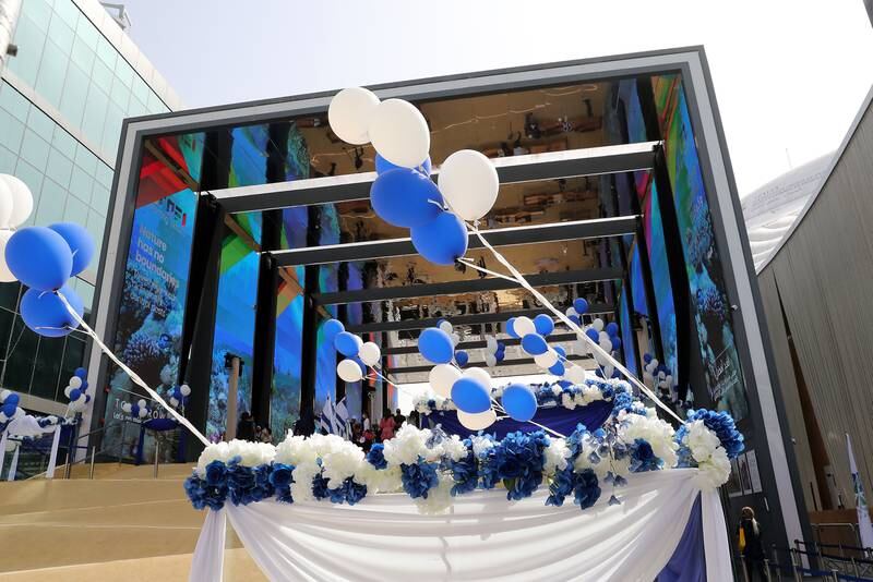 The Israeli pavilion is decorated with blue and white balloons.