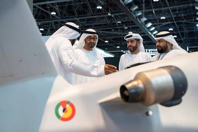 ABU DHABI, UNITED ARAB EMIRATES - February 21, 2019: HH Sheikh Mohamed bin Zayed Al Nahyan, Crown Prince of Abu Dhabi and Deputy Supreme Commander of the UAE Armed Forces (2nd L), visits Earth stand, during the 2019 International Defence Exhibition and Conference (IDEX), at Abu Dhabi National Exhibition Centre (ADNEC). 

( Ryan Carter for the Ministry of Presidential Affairs )
---