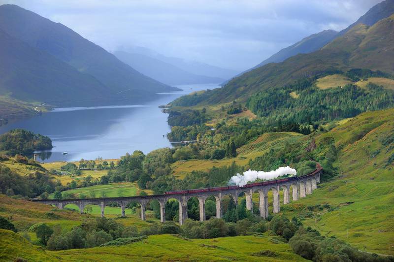 11 Sep 2009, Scottish Highlands, Scotland, UK --- United Kingdom, Scotland, Highland, the Jacobite Steam Train, better known now as the Harry Potter Train, crossing the viaduct of Glenfinnan with loch Shiel in the background --- Image by © BOISVIEUX Christophe/Hemis/Corbis