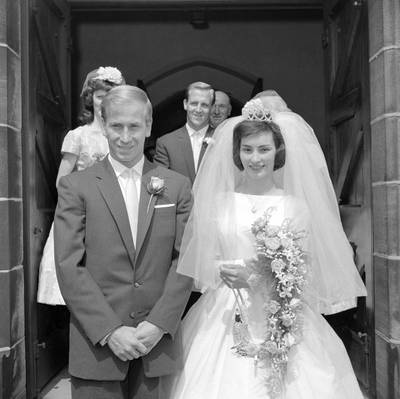 Bobby Charlton and his bride, fashion model Norma Ball, leave St. Gabriel's church in Middleton, near Manchester, after their wedding on July 22, 1961. AP