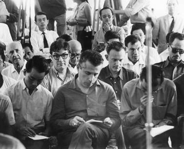 FILE - Journalists attend a briefing by military officers in Saigon, in this 1963 file photo. At center, foreground, is Seymour Topping of the New York Times. Immediately behind him at right (no glasses) is Malcolm Browne of the Associated Press. Topping, among the most accomplished foreign correspondents of his generation for The Associated Press and the New York Times and later a top editor at the Times and administrator of the Pulitzer Prizes, died on Sunday, Nov. 8, 2020, in White Plains, N.Y. He was 99. Topping passed away “peacefully” at White Plains Hospital, his daughter Rebecca said in an emailed statement (AP Photo)
