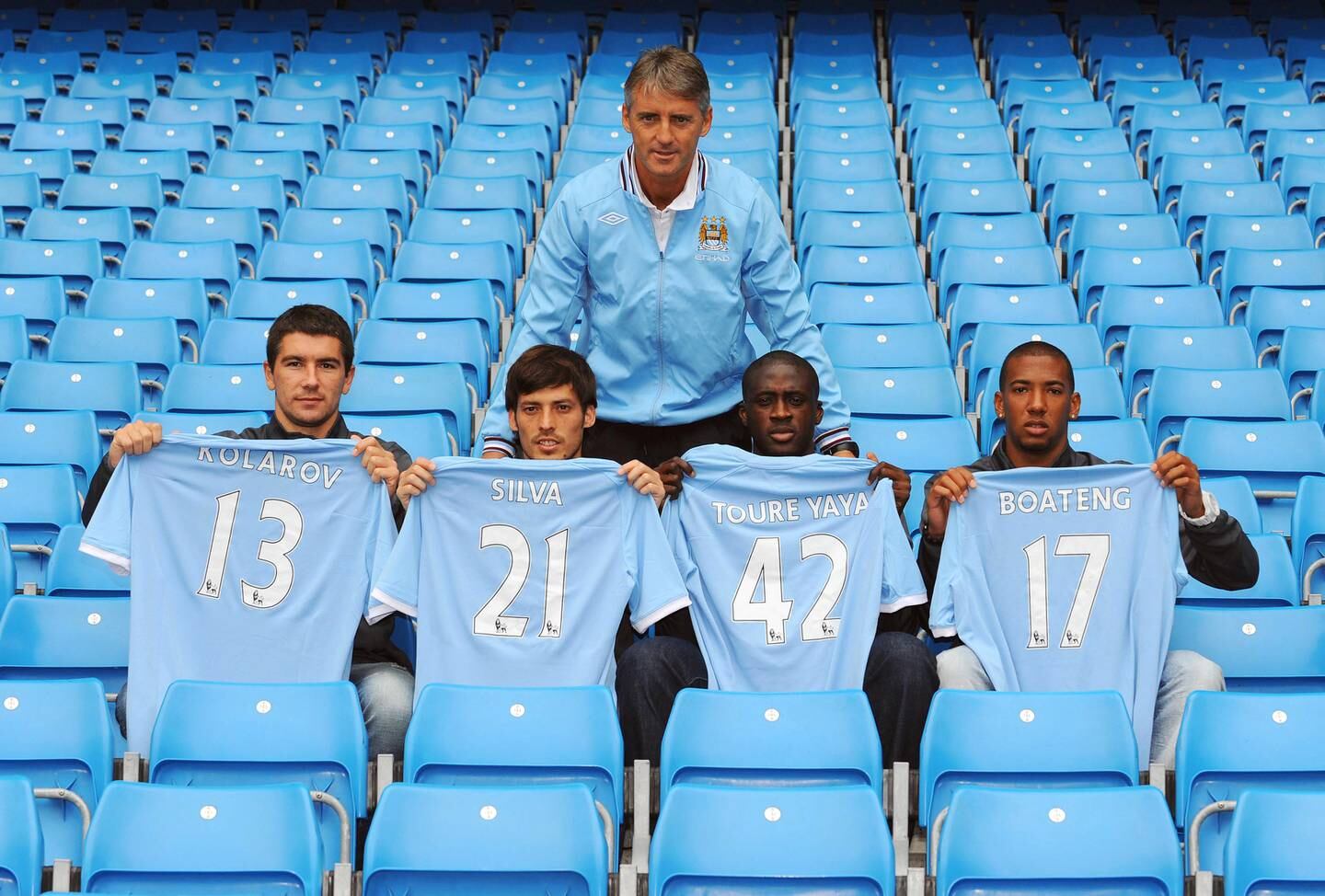 MANCHESTER, ENGLAND - AUGUST 6:  Manager Roberto Mancini (C) poses with new signings (L-R) Aleksandar Kolarov, David Silva, Yaya Toure and Jerome Boateng during a Manchester City training session at the City of Manchester Stadium on August 6, 2010 in Manchester, England.  (Photo by Clint Hughes/Getty Images)