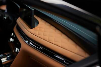 The Japanese-influenced interior includes plush leather details.