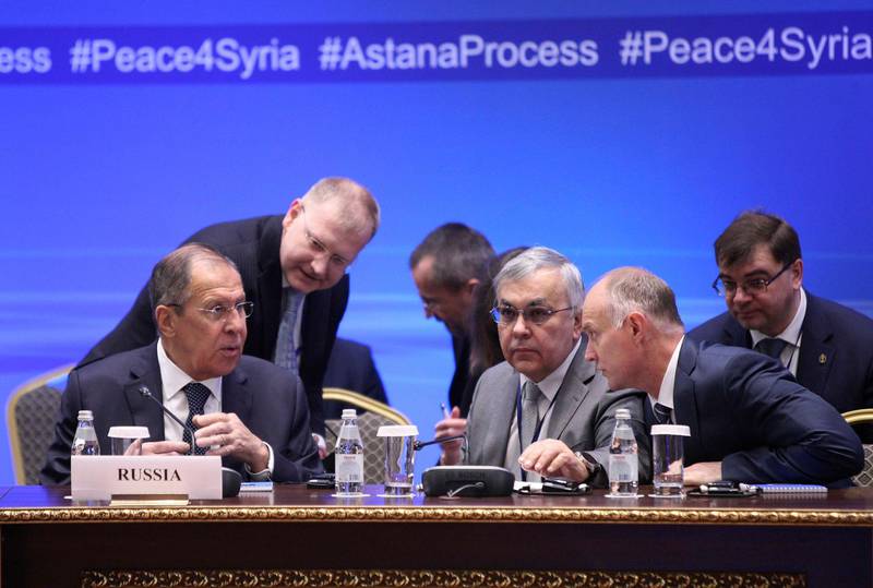 Russian Foreign Minister Sergei Lavrov (L) speaks with other participants during the international meeting on Syria in Astana, Kazakhstan March 16, 2018. REUTERS/Mukhtar Kholdorbekov