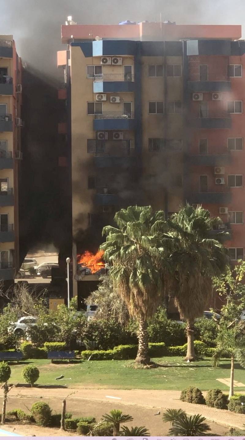 Smoke and fire rise from an apartment building, after a shell hit the complex in Khartoum. Reuters