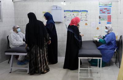 Medical personnel with patients at the Imbaba Fevers Hospital in Cairo. EPA