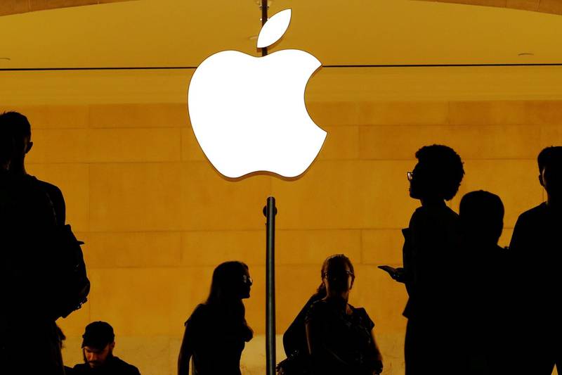 FILE PHOTO: Customers walk past an Apple logo inside of an Apple store at Grand Central Station in New York, U.S., August 1, 2018.  REUTERS/Lucas Jackson/File Photo