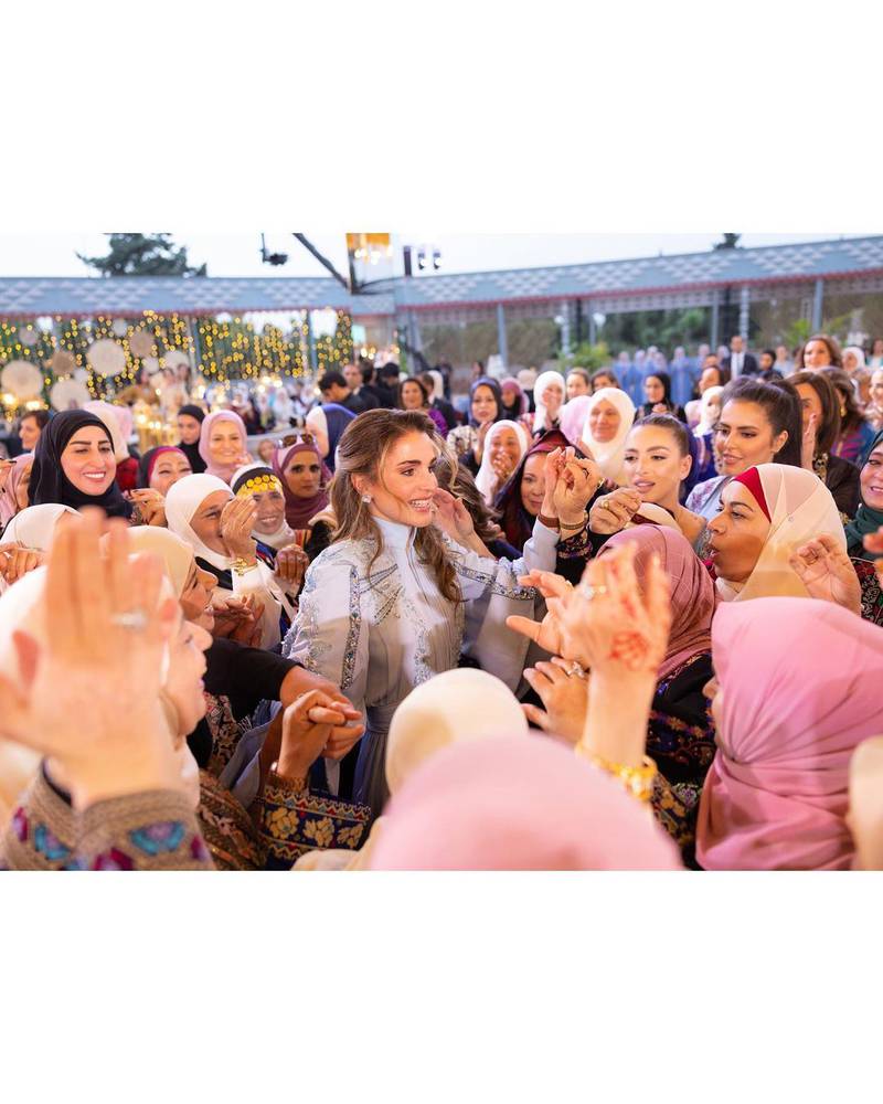 Queen Rania greets guests at the henna party