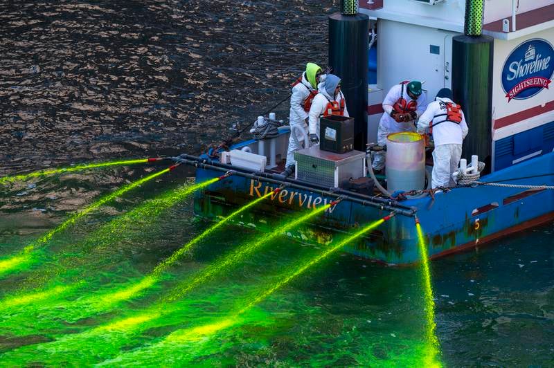 Members of the Plumbers Union dye the river green before this year's celebrations. AP