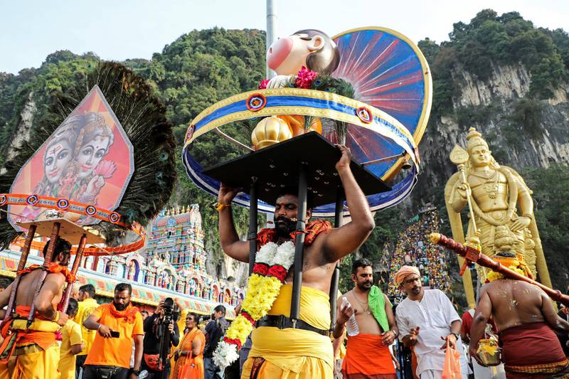 A Hindu devotee carries a Kavadi as he takes part in a procession during Thaipusam at Batu Caves in Kuala Lumpur, Malaysia. REUTERS