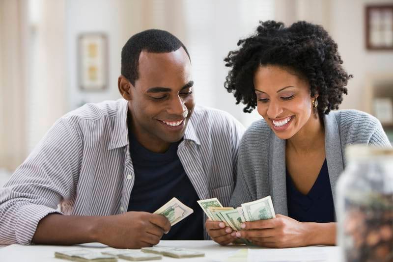 It is essential to be open with your partner about your individual financial situations, especially as your relationship gets more serious. Getty