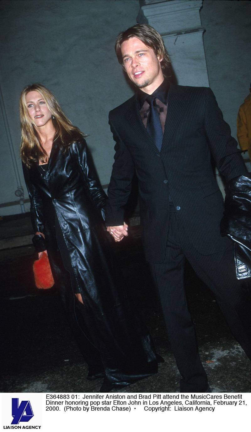 E364883 01: Jennifer Aniston and Brad Pitt attend the MusicCares Benefit Dinner honoring pop star Elton John in Los Angeles, California, February 21, 2000. (Photo by Brenda Chase)