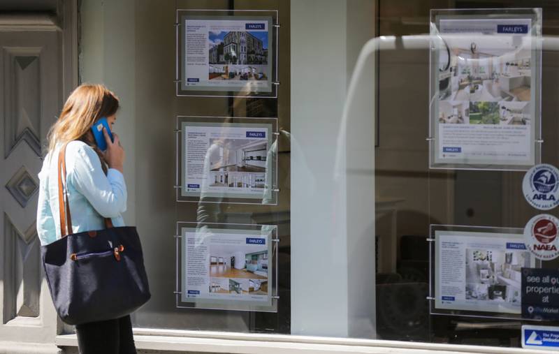 A property agent in London where house prices have climbed to a record high. AFP