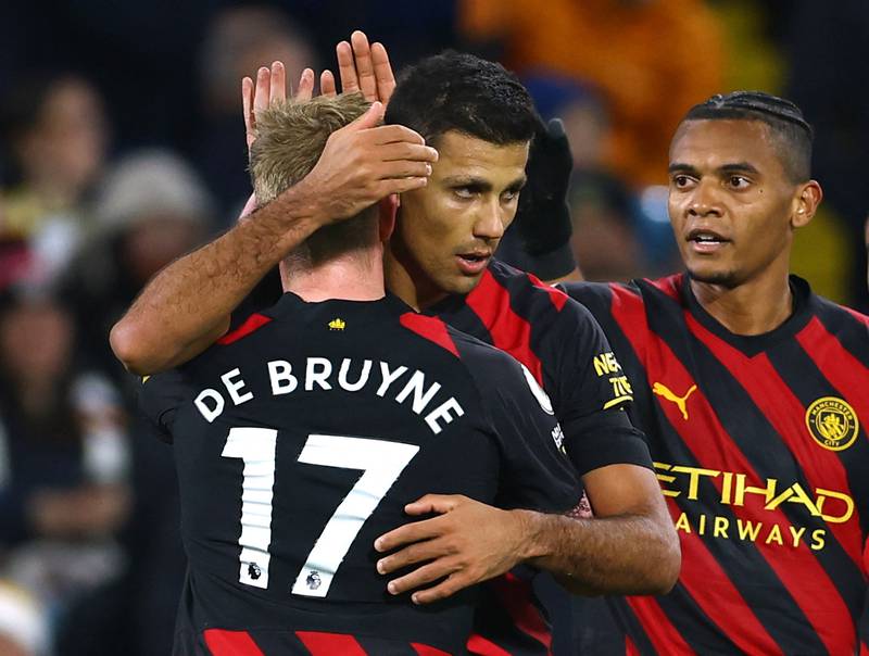 City's Rodri celebrates scoring their first goal with Kevin De Bruyne and Manuel Akanji. Reuters