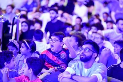 Fans at Yas Mall in Abu Dhabi watch Manchester City beat Inter Milan to win the Champions League final. Khushnum Bhandari / The National