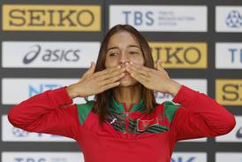Morocco's bronze medallist Fatima Ezzahra Gardadi celebrates on the podium after the women's marathon. Reuters