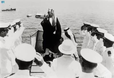 King Abdulaziz is greeted by American soldiers in 1945.