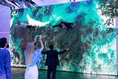 DUBAI, UNITED ARAB EMIRATES - OCTOBER 14, 2018. 

Du's booth at Gitex Technology Week offered a mirror screen where visitors were able to fly across landscapes from the UAE.

(Photo by Reem Mohammed/The National)

Reporter: 
Section:  NA