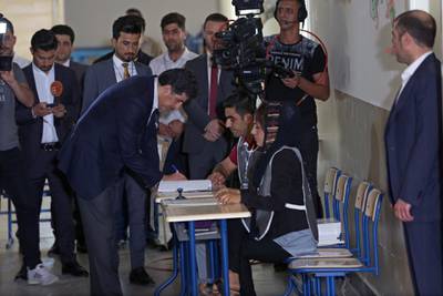 Prime Minister of Iraqi Kurdistan Nechirvan Barzani, centre, during voting in the Kurdistan parliamentary election at a polling station in Erbil, the capital of the Kurdistan Region in Iraq.  EPA