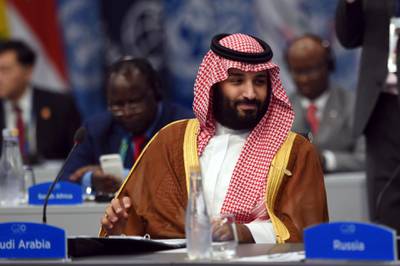 In this photo released by the press office of the G20 Summit Saudi Arabia's Crown Prince Mohammed bin Salman attends a plenary session on the second day of the G20 Leader's Summit in Buenos Aires, Argentina, Saturday, Dec. 1, 2018. (G20 Press Office via AP)