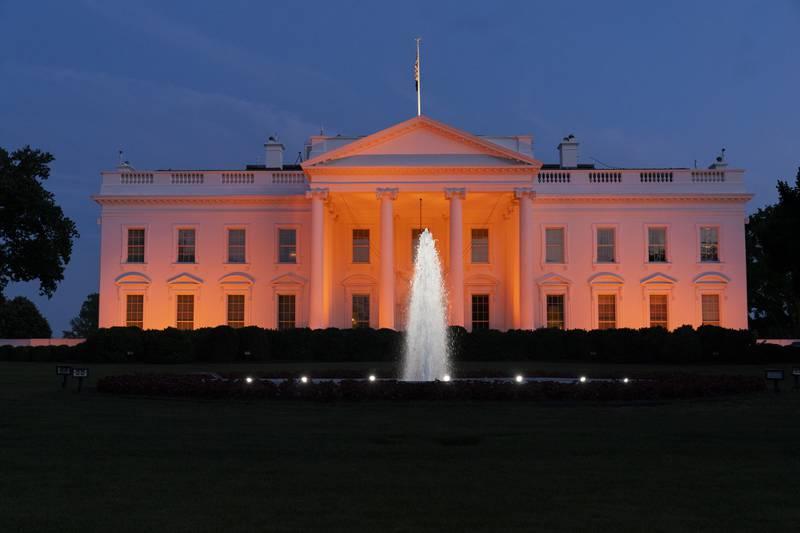 The White House is illuminated with orange lights in honour of National Gun Violence Awareness Day. AP