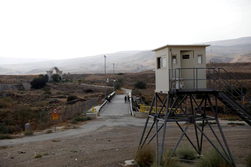 Journalists can be seen at the border area between Israel and Jordan at Naharayim, as seen from the Israeli side. Reuters