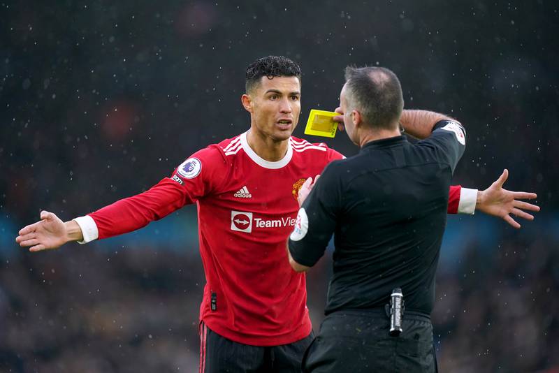 Manchester United's Cristiano Ronaldo is shown a yellow card by referee Paul Tierney. PA