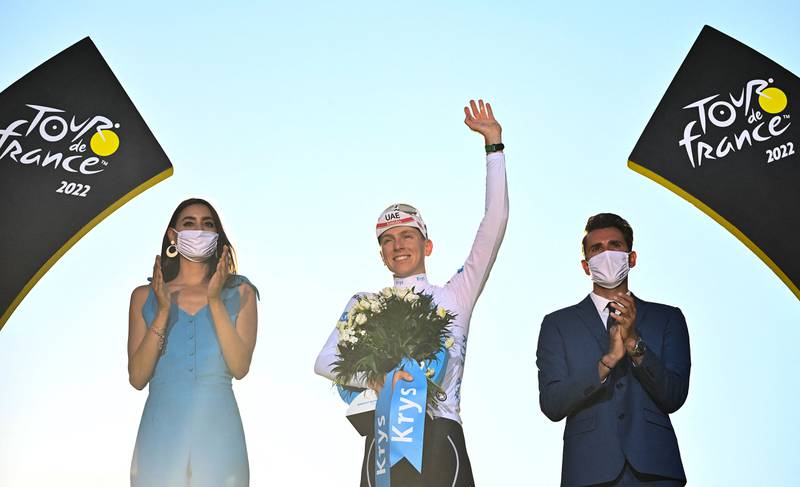 UAE Team Emirates rider Tadej Pogacar on the podium wearing the best young rider's white jersey. The Slovenian finished second behind Jonas Vingegaard in the overall standings. AFP
