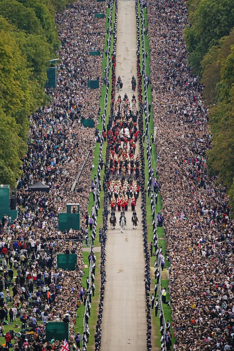 The ceremonial procession travels down the Long Walk in Windsor. PA