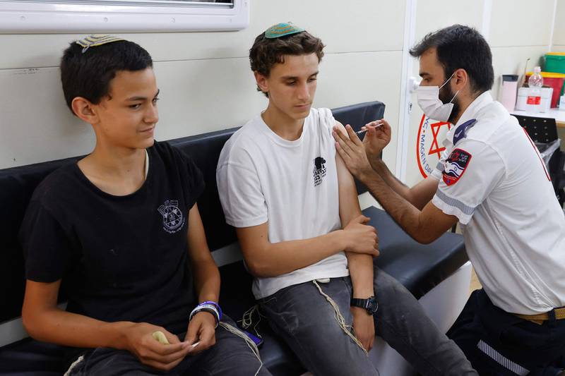 Israeli youths receive a dose of the Pfizer/BioNTech Covid-19 vaccine. Some 5.2 million people have received both doses of the Pfizer-BioNTech vaccine, after Israel obtained millions of doses.