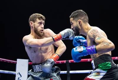 Dubai-based Bader Samreen, left, of Jordan, on his way to victory against Jose Paez Gonzales of Mexico in their lightweight bout.