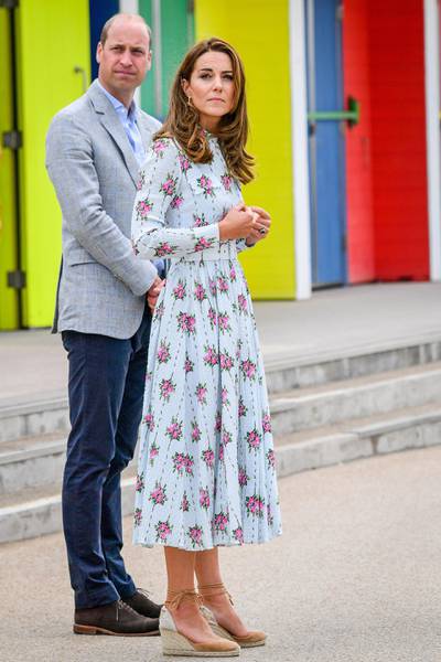 BARRY, WALES - AUGUST 05:  Prince William, Duke of Cambridge and Catherine, Duchess of Cambridge on the promenade as they visit beach huts during their visit to Barry Island, South Wales, to speak to local business owners about the impact of COVID-19 on the tourism sector on August 5, 2020 in Barry, Wales. (Photo by Ben Birchall - WPA Pool/Getty Images)