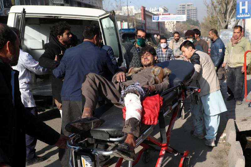 An injured man is carried to a hospital after rockets hit residential areas in Kabul, Afghanistan. REUTERS