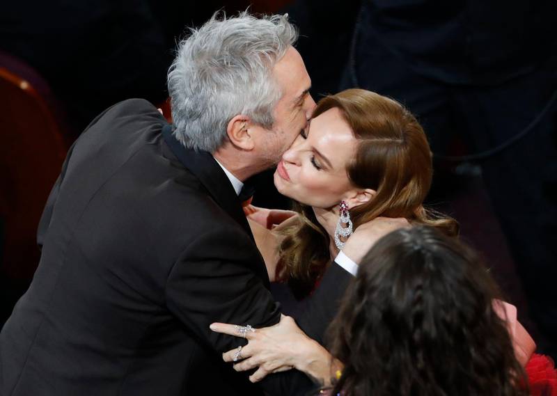 Cinematography winner Alfonso Cuaron celebrates with 'Roma' actress Marina de Tavira. Photo: Reuters