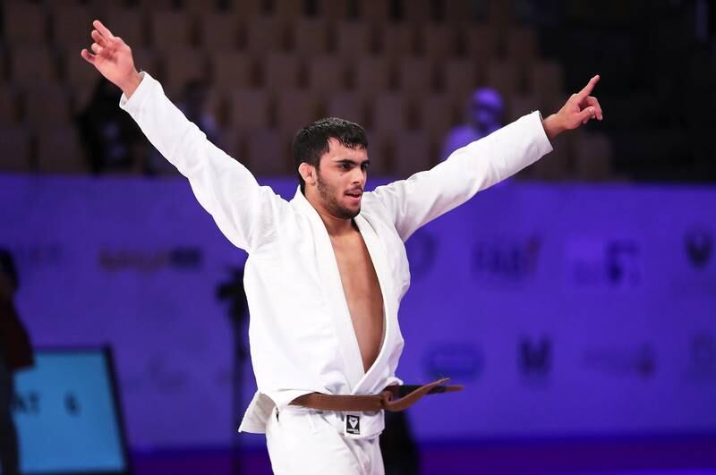 The UAE's Omar Al Fadhli celebrates after winning the final of 62 kg brown belt category against Leonardo Mario of Brazil in the World Professional Jiu-Jitsu championship held at Zayed Sports City’s Jiu-Jitsu Arena in Abu Dhabi on November 18, 2021. Pawan Singh / The National
