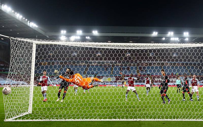 Liverpool's Sadio Mane scores their third goal. Reuters