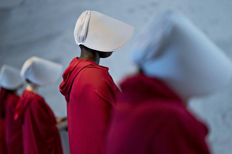 Bloomberg Best of the Year 2018: Demonstrators dressed in "Handmaid's Tale" costumes stand in the Dirksen Senate Office building before a Senate Judiciary Committee confirmation hearing for Brett Kavanaugh, U.S. Supreme Court associate justice nominee for U.S. President Donald Trump, not pictured, in Washington, D.C., U.S., on Tuesday, Sept. 4, 2018. Photographer: Andrew Harrer/Bloomberg