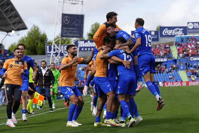 Getafe's Mason Greenwood, centre right, joins in the celebrations after teammate Nemanja Maksimovic scored his side's third goal in a 3-2 win against Osasuna. AP