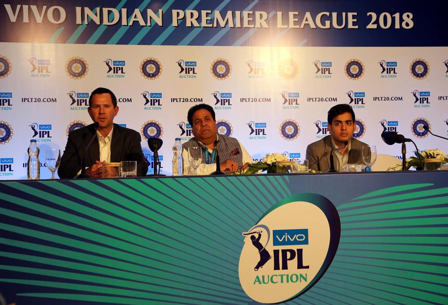 Former Australian cricketer and Delhi Daredevils team coach Ricky Ponting, left, IPL Chairman Rajeev Shukla, center, and Mumbai Indians' team owner Akash Ambani attend a press conference on the first day of the Indian Premier League (IPL) player auction in Bangalore, India, Saturday, Jan. 27, 2018. The IPL auctions are being held in Bangalore for the eleventh edition of the domestic Twenty20 cricket tournament, which will be held at different venues across the country with eight teams participating. (AP Photo/Aijaz Rahi)