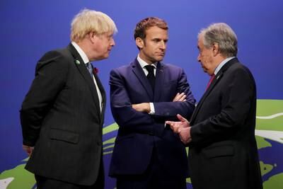 Boris Johnson and Antonio Guterres in discussion with French President Emmanuel Macron. Reuters