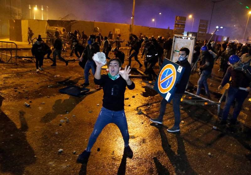 Anti-government demonstrators clash with riot police in Beirut. AP Photo