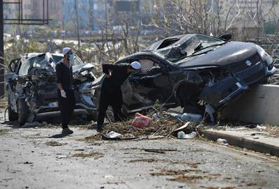 Lebanese Druze clerics check damaged cars. AP Photo