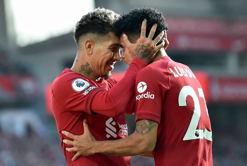 Roberto Firmino celebrates with teammate Luis Diaz after scoring his second goal. EPA