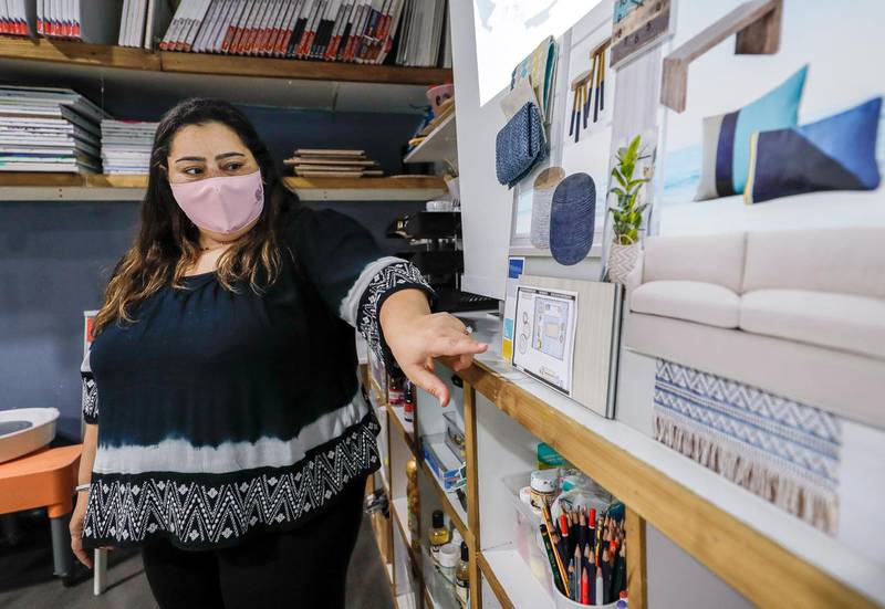 Abu Dhabi, United Arab Emirates, March 15, 2021.  A peek inside an interior design class at Art Central, Boutik Mall.  The class aims to enable people to take it up professionally.  Arwa Elnahas explains to the class her Boho Rustic beach house.Victor Besa/The NationalSection:  LF