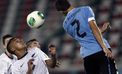 Uruguay's Joel Bregonis  heads the ball. Karim Sahib / AFP Photo